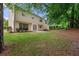 Two-story house featuring a spacious backyard, patio, and mature trees at 4805 Wilkie Nw Way, Acworth, GA 30102
