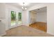 Bright dining area featuring a stylish chandelier and glass door leading to the backyard at 4805 Wilkie Nw Way, Acworth, GA 30102