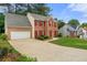 Well-maintained two-story home with brick facade, red shutters, and attached garage at 4805 Wilkie Nw Way, Acworth, GA 30102