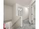 Upstairs hallway with a carpeted floor and stairs leading to the lower level at 4805 Wilkie Nw Way, Acworth, GA 30102