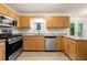 Updated kitchen features granite countertops, stainless steel appliances, and stylish cabinetry at 4805 Wilkie Nw Way, Acworth, GA 30102