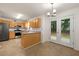 Bright eat-in kitchen with granite countertops, stainless steel appliances, and backyard access at 4805 Wilkie Nw Way, Acworth, GA 30102