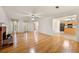 Open-concept living room with hardwood floors, fireplace, and easy access to the kitchen at 4805 Wilkie Nw Way, Acworth, GA 30102