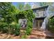 The backyard features a pergola, a deck and lush landscaping at 2930 Winchester Dr, Cumming, GA 30041