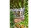 Backyard featuring a wood deck, lush vines and manicured garden beds at 2930 Winchester Dr, Cumming, GA 30041