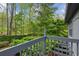 Balcony overlooking lush greenery with beautiful backyard landscaping at 2930 Winchester Dr, Cumming, GA 30041