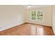 Bedroom featuring hardwood floors, natural lighting and neutral wall paint at 2930 Winchester Dr, Cumming, GA 30041
