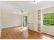 Bright bedroom features hardwood floors, natural light, built-in shelving, and ceiling fan at 2930 Winchester Dr, Cumming, GA 30041
