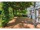 Exterior shot of wood deck featuring lush vine-covered pergola at 2930 Winchester Dr, Cumming, GA 30041