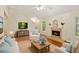Cozy living room with a fireplace, hardwood floors, and comfortable seating at 2930 Winchester Dr, Cumming, GA 30041