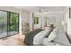 Bright main bedroom with balcony access, built-in shelving and a mirrored closet at 2930 Winchester Dr, Cumming, GA 30041