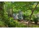 Backyard outbuilding in a private garden setting with a raised walkway at 2930 Winchester Dr, Cumming, GA 30041