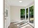 Sunroom with stone floors and large windows offering views of the surrounding greenery at 2930 Winchester Dr, Cumming, GA 30041
