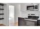 Modern kitchen includes stainless steel appliances, range hood and ample countertops at 8833 E Bourne E Dr, Jonesboro, GA 30238