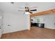 Open floor plan with wood plank floors looking into a kitchen and dining area at 8833 E Bourne E Dr, Jonesboro, GA 30238
