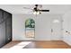Bright living room with wood plank flooring and black accent wall at 8833 E Bourne E Dr, Jonesboro, GA 30238