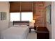 A cozy bedroom featuring natural light, neutral tones, and simple, elegant furnishings at 172 Haynes Sw St # 107, Atlanta, GA 30313