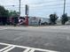 Exterior view of a building adorned with large murals, located at a street corner with visible crosswalk markings at 172 Haynes Sw St # 107, Atlanta, GA 30313