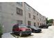 Exterior view of the building with cars parked along the side, offering convenient parking at 172 Haynes Sw St # 107, Atlanta, GA 30313