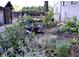 Beautiful garden landscape, complete with seating, shrubbery, and privacy fence at 172 Haynes Sw St # 107, Atlanta, GA 30313