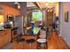 Modern kitchen featuring stainless steel appliances, wooden cabinets, and an island with barstool seating at 172 Haynes Sw St # 107, Atlanta, GA 30313
