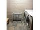 The laundry room features a front loading washer/dryer set, a storage cart and tiled flooring at 172 Haynes Sw St # 107, Atlanta, GA 30313