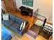 A living room with hardwood floors, gray sofa, and decorative art at 172 Haynes Sw St # 107, Atlanta, GA 30313