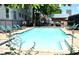 Refreshing in-ground pool with lounge chairs in a fenced community setting at 172 Haynes Sw St # 107, Atlanta, GA 30313