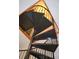 Unique spiral staircase leading upwards to a stained-glass window at 172 Haynes Sw St # 107, Atlanta, GA 30313
