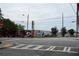 Street view of buildings with vibrant murals and signage along the crosswalk at 172 Haynes Sw St # 107, Atlanta, GA 30313