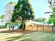 Spacious fenced backyard with mature trees providing privacy and shade at 2536 Caray Ne Ct, Lawrenceville, GA 30043