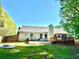 Backyard features a concrete patio, play set, and a wood deck perfect for outdoor enjoyment at 2536 Caray Ne Ct, Lawrenceville, GA 30043