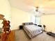 Comfortable bedroom with a ceiling fan and a king-size bed; treadmill included at 2536 Caray Ne Ct, Lawrenceville, GA 30043