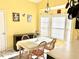 Cozy breakfast nook with bright yellow walls, natural light, and charming decor at 2536 Caray Ne Ct, Lawrenceville, GA 30043