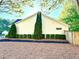Exterior view of home showing manicured bushes along the side of the property at 2536 Caray Ne Ct, Lawrenceville, GA 30043