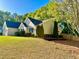 Well-maintained house with landscaped lawn, mature trees and a freshly mulched garden bed at 2536 Caray Ne Ct, Lawrenceville, GA 30043