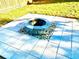 Close up of backyard fire pit with stone surround on stone paver base at 2536 Caray Ne Ct, Lawrenceville, GA 30043