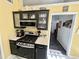 Stylish kitchen featuring a gas range, stainless steel appliances, and ample cabinet space for storage at 2536 Caray Ne Ct, Lawrenceville, GA 30043