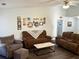 Comfortable living room with plush sofas, stylish coffee table, and a curated gallery wall at 2536 Caray Ne Ct, Lawrenceville, GA 30043