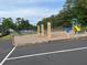 Community playground featuring a swing set, slide, and seating, adjacent to a tennis court for recreational activities at 2536 Caray Ne Ct, Lawrenceville, GA 30043