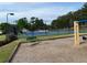 Tennis court with playground in the background and a green park bench in the foreground at 2536 Caray Ne Ct, Lawrenceville, GA 30043