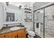 Modern bathroom featuring a marble shower, granite countertop vanity and black tile flooring at 5300 Peachtree Rd # 3601, Atlanta, GA 30341