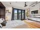 Hardwood bedroom showcasing modern decor and access to a private balcony at 5300 Peachtree Rd # 3601, Atlanta, GA 30341