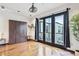 Modern bedroom offers a wardrobe closet and balcony access through glass doors at 5300 Peachtree Rd # 3601, Atlanta, GA 30341