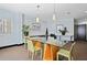 Bright conference room features a glass table, stylish lighting, and plenty of space for meetings at 5300 Peachtree Rd # 3601, Atlanta, GA 30341