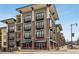Multi-story building boasting modern design with balconies, large windows, and street-level retail at 5300 Peachtree Rd # 3601, Atlanta, GA 30341