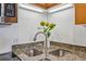 Granite countertop with double bowl stainless steel kitchen sink and modern faucet at 5300 Peachtree Rd # 3601, Atlanta, GA 30341