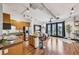 Open concept living area featuring hardwood floors, kitchen island, and balcony access at 5300 Peachtree Rd # 3601, Atlanta, GA 30341