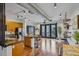Bright living room with hardwood floors, kitchen with stainless steel appliances and doors to balcony at 5300 Peachtree Rd # 3601, Atlanta, GA 30341