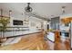 Modern open concept living and kitchen area featuring stainless steel appliances and island seating at 5300 Peachtree Rd # 3601, Atlanta, GA 30341